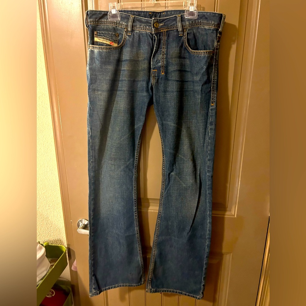 Diesel jeans. Medium blue wash with slightly flared bottom. Size 33.
